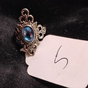 Ornate Silver Ring with Blue Gemstone